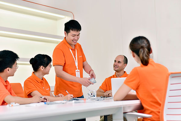 Orantech's medical cable design team reviews a prototype in early product development stages.